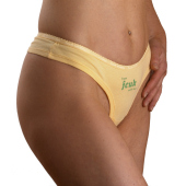 Close-up of yellow fcuk briefs worn by model.